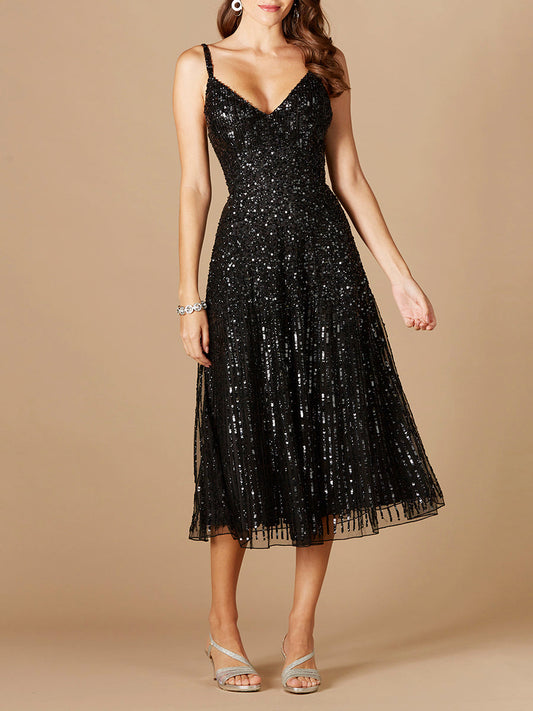 Vestido midi de lentejuelas con caída