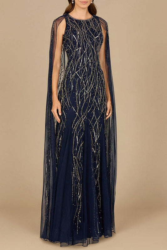 Vestido elegante con pedrería y capa larga